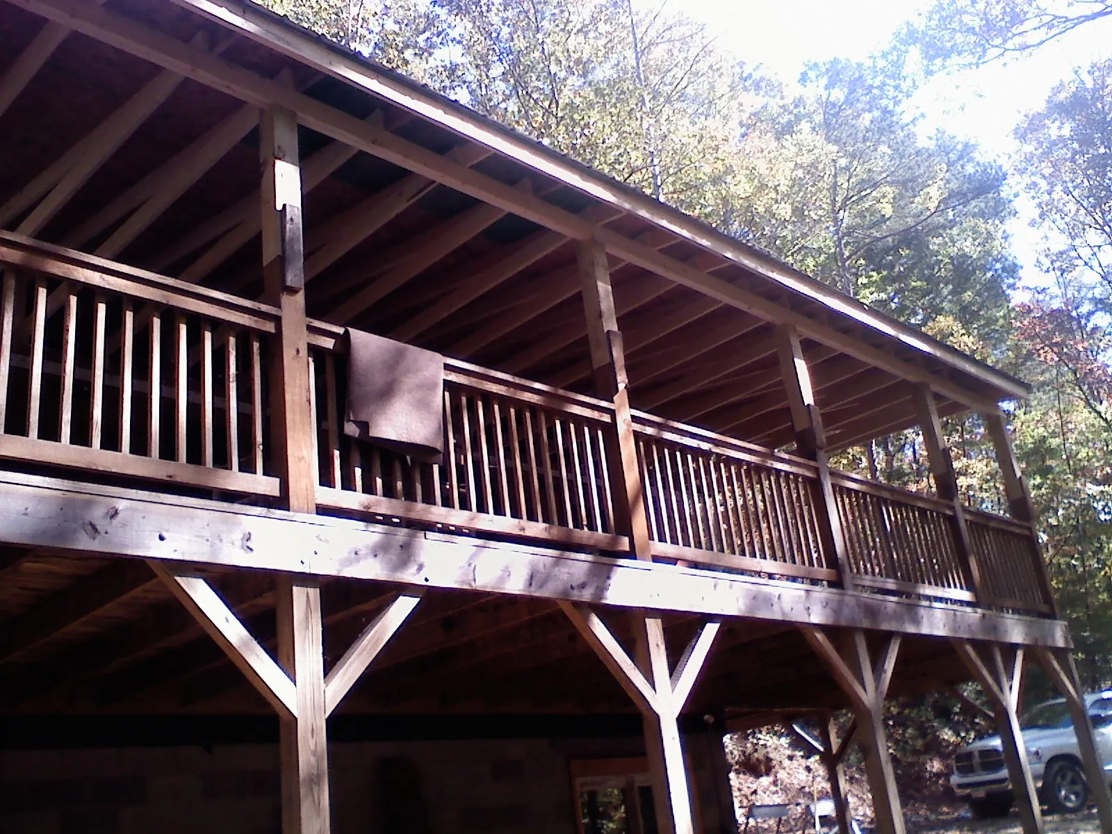 Timber framing under a new elevated porch and deck — Roof Leak Repair in Piney Creek by Roofing Brothers